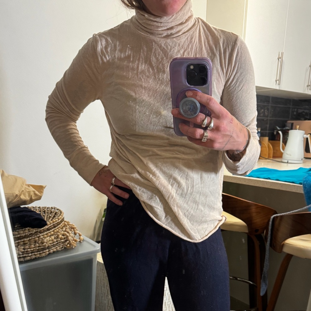 A Mente softest sheer tencel and wool turtleneck layer top in pale pink